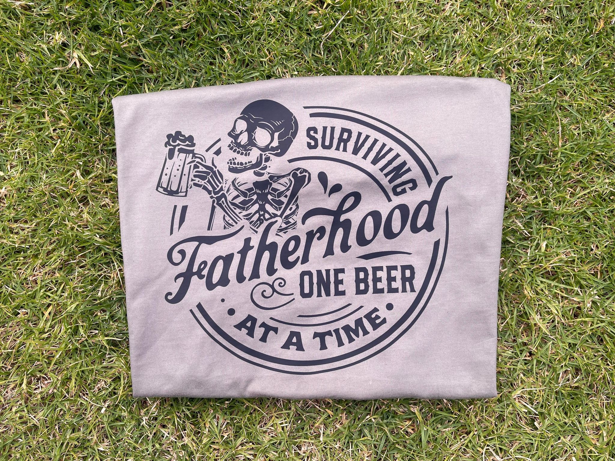 Surviving Fatherhood One Beer At A Time Tee