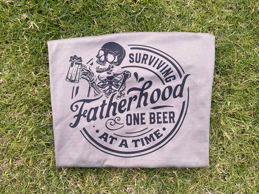 Surviving Fatherhood One Beer At A Time Tee